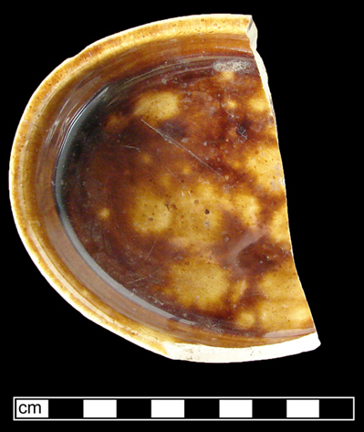Federal Reserve Site - Unidentified oval shaped hollow vessel, probably a nappie, Rockingham glaze on buff-bodied earthenware. (side and top view.)